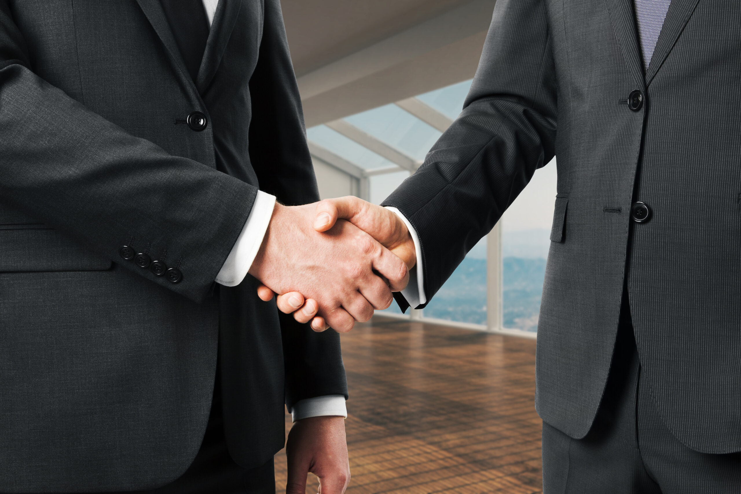 closeup of businessmen shaking hands in modern int 2026 01 11 08 32 41 utc